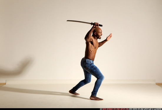 Man Adult Athletic Black Fighting with sword Moving poses Pants