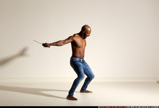 Man Adult Athletic Black Fighting with sword Moving poses Pants