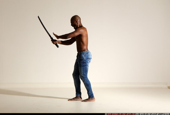 Man Adult Athletic Black Fighting with sword Moving poses Pants