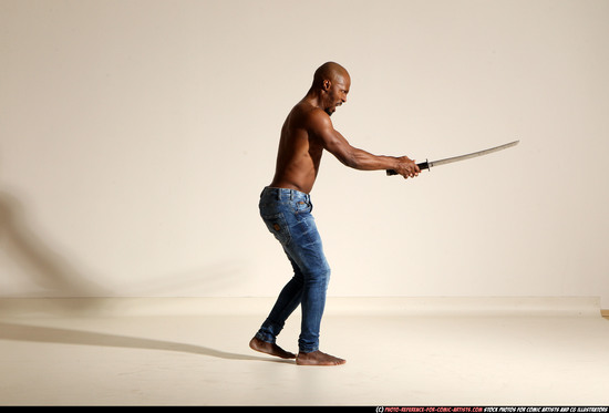 Man Adult Athletic Black Fighting with sword Moving poses Pants