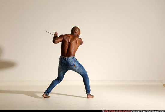 Man Adult Athletic Black Fighting with sword Moving poses Pants