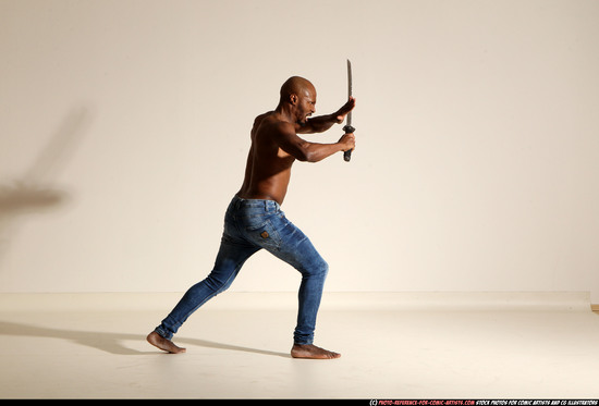 Man Adult Athletic Black Fighting with sword Moving poses Pants