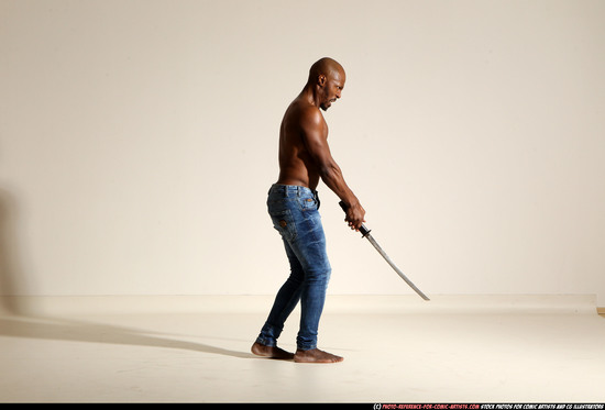 Man Adult Athletic Black Fighting with sword Moving poses Pants