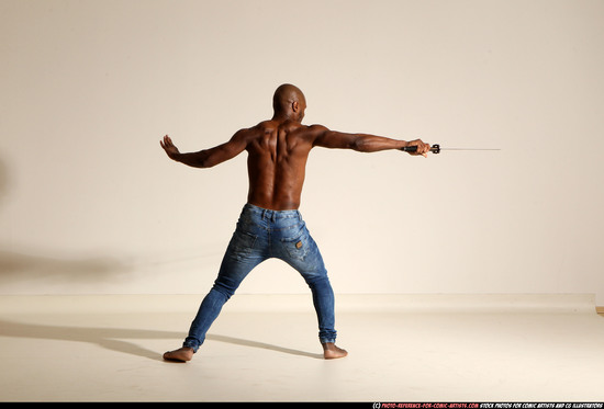 Man Adult Athletic Black Fighting with sword Moving poses Pants