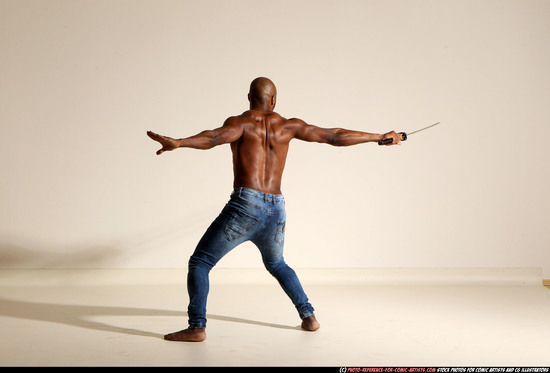 Man Adult Athletic Black Fighting with sword Moving poses Pants