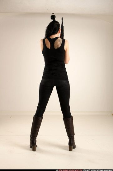 Woman Adult Athletic White Fighting with gun Standing poses Casual