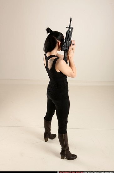 Woman Adult Athletic White Fighting with gun Standing poses Casual