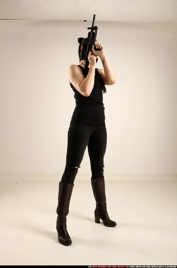 Woman Adult Athletic White Fighting with gun Standing poses Casual