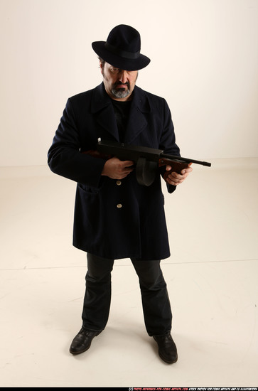 Man Old Average White Fighting with gun Standing poses Coat