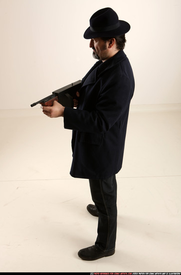 Man Old Average White Fighting with gun Standing poses Coat