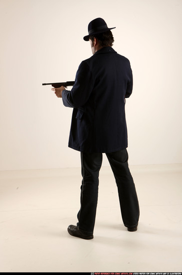 Man Old Average White Fighting with gun Standing poses Coat