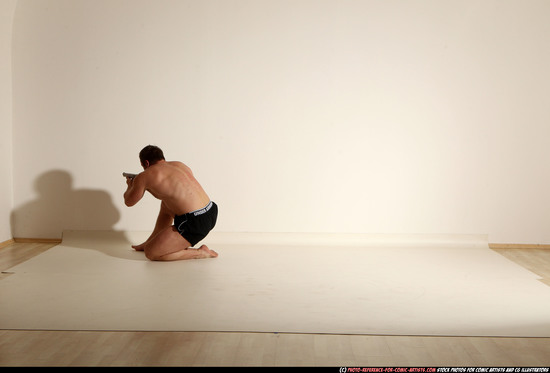 Man Adult Muscular White Fighting with gun Moving poses Underwear