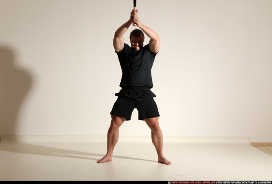 Man Adult Muscular White Moving poses Sportswear Fighting with bat