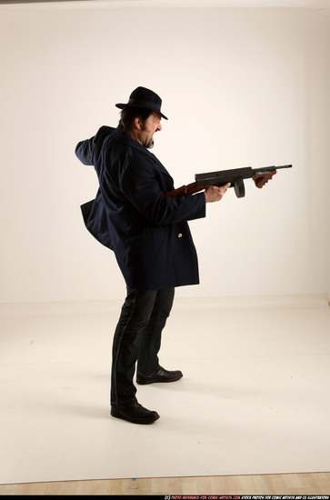 Man Old Average White Fighting with gun Standing poses Coat