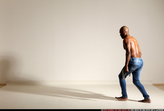 Man Adult Athletic Black Fighting with gun Moving poses Pants