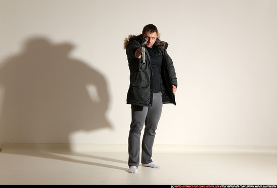 Man Adult Muscular White Fighting with gun Standing poses Casual