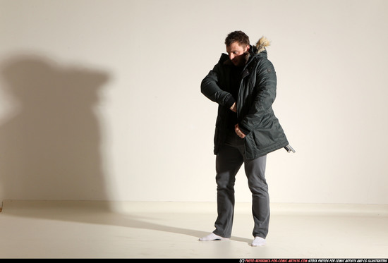 Man Adult Muscular White Fighting with gun Standing poses Casual