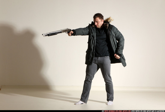 Man Adult Muscular White Fighting with gun Standing poses Casual