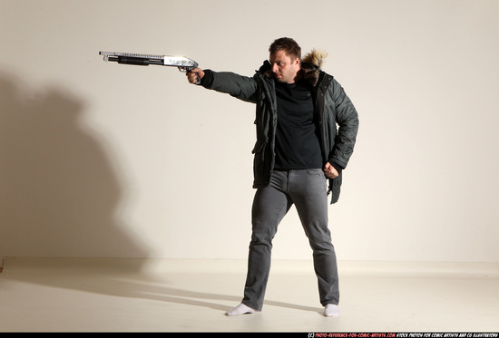 Man Adult Muscular White Fighting with gun Standing poses Casual