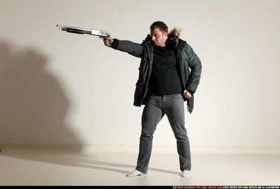 Man Adult Muscular White Fighting with gun Standing poses Casual