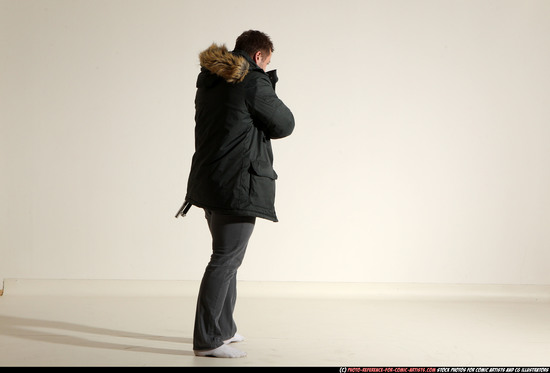 Man Adult Muscular White Fighting with gun Standing poses Casual