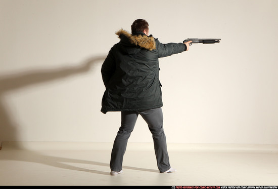 Man Adult Muscular White Fighting with gun Standing poses Casual