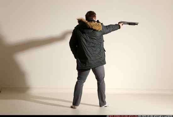 Man Adult Muscular White Fighting with gun Standing poses Casual