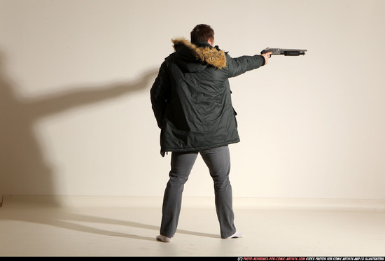 Man Adult Muscular White Fighting with gun Standing poses Casual