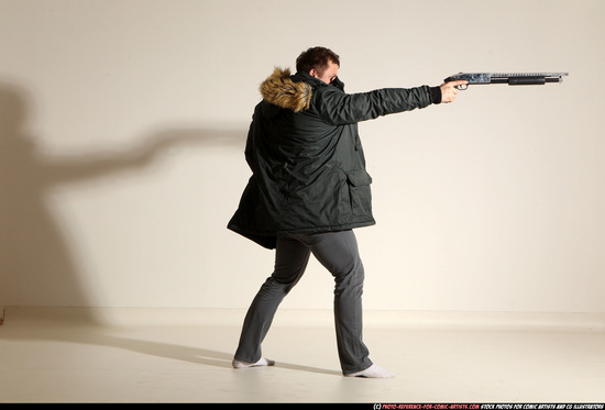 Man Adult Muscular White Fighting with gun Standing poses Casual