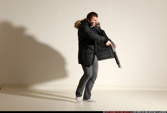 Man Adult Muscular White Fighting with gun Standing poses Casual