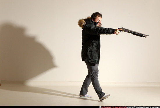 Man Adult Muscular White Fighting with gun Standing poses Casual