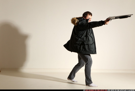 Man Adult Muscular White Fighting with gun Standing poses Casual