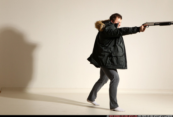 Man Adult Muscular White Fighting with gun Standing poses Casual