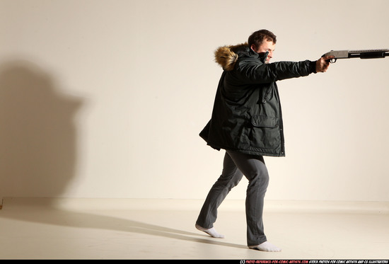 Man Adult Muscular White Fighting with gun Standing poses Casual