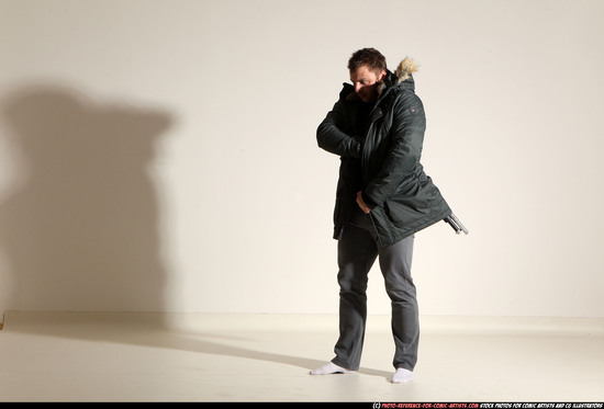 Man Adult Muscular White Fighting with gun Standing poses Casual