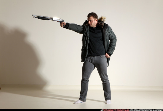 Man Adult Muscular White Fighting with gun Standing poses Casual