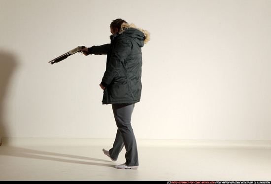 Man Adult Muscular White Fighting with gun Standing poses Casual