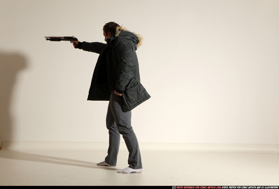 Man Adult Muscular White Fighting with gun Standing poses Casual