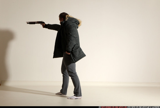 Man Adult Muscular White Fighting with gun Standing poses Casual