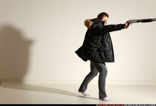 Man Adult Muscular White Fighting with gun Standing poses Casual