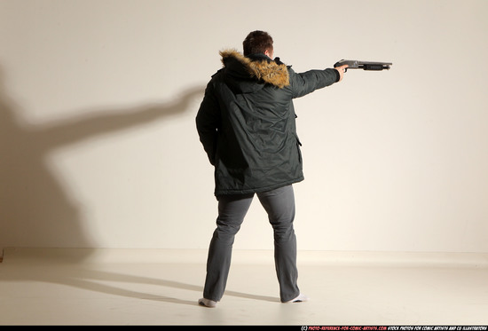 Man Adult Muscular White Fighting with gun Standing poses Casual