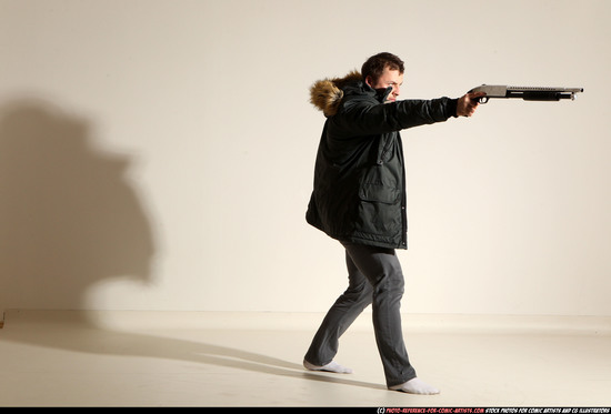 Man Adult Muscular White Fighting with gun Standing poses Casual