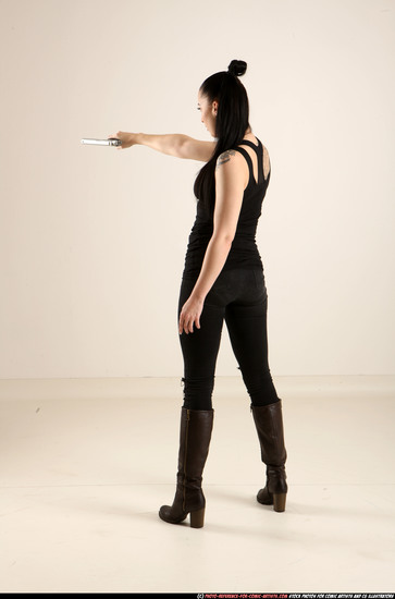 Woman Adult Athletic White Fighting with gun Standing poses Casual