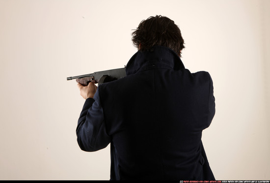 Man Old Average White Fighting with submachine gun Standing poses Coat