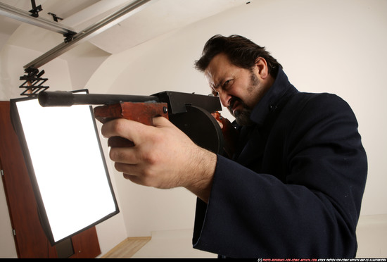 Man Old Average White Fighting with submachine gun Standing poses Coat