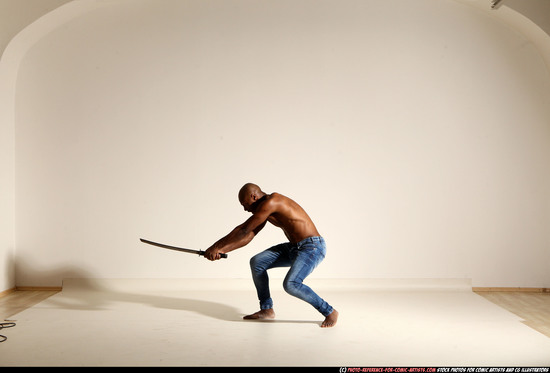 Man Adult Athletic Black Fighting with sword Moving poses Pants