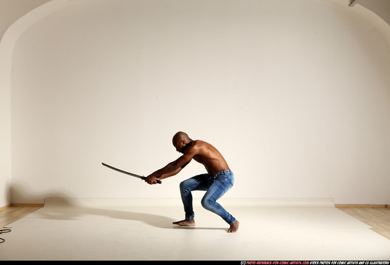 Man Adult Athletic Black Fighting with sword Moving poses Pants