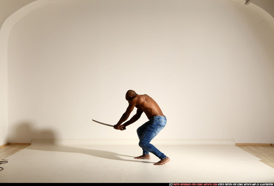 Man Adult Athletic Black Fighting with sword Moving poses Pants