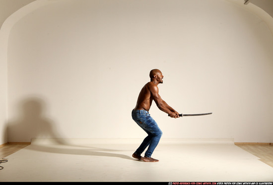 Man Adult Athletic Black Fighting with sword Moving poses Pants