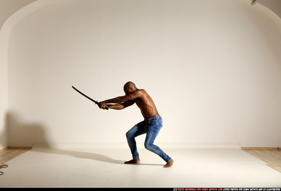 Man Adult Athletic Black Fighting with sword Moving poses Pants